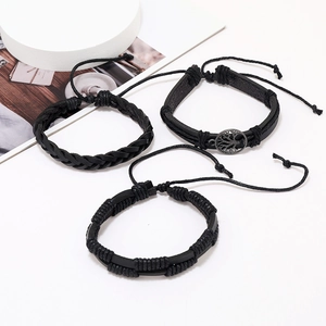 Three-piece black braided leather bracelets set featuring a Tree of Life metal charm
