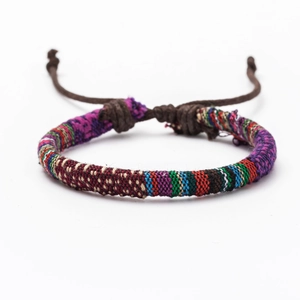 Detailed view of colorful Bohemian woven friendship bracelet with adjustable knot