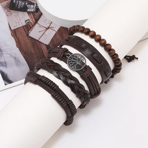 Detail view of 4-piece vintage leather bracelet set with tree of life and wooden beads