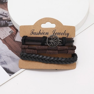 Detailed set of leather bracelets featuring a bronze Tree of Life charm and woven cord