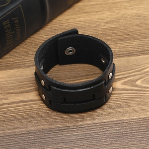 Punk style black leather bracelet with silver metal rivets and snap buttons