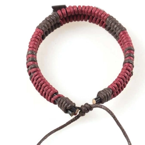Detailed view of handmade braided arrow bracelet with adjustable wax cord in two colors