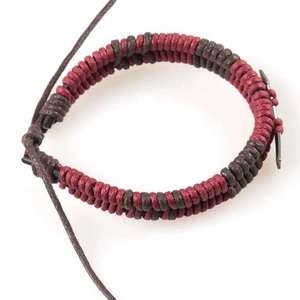 Close-up of woven rope bracelet with dark red cords and a grey metal nail clasp