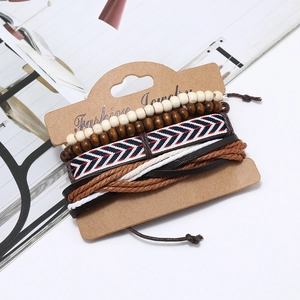 Retro multilayer bracelet set featuring wooden beads and woven leather on display card