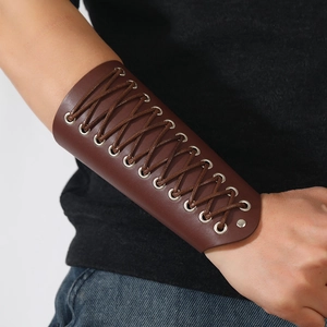 Punk style brown leather arm bracer with metal eyelets and cross lace-up design