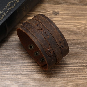 Vintage punk style wide brown leather bracelet with metal snaps and stitching details