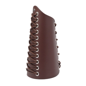Detail of dark brown medieval leather arm guard with silver eyelets and crisscross lacing
