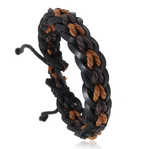 Macro shot of adjustable braided leather bracelet with multi-layer cord weaving details