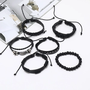 6-piece black woven leather bracelet set for men with metal rivets and beads on white background
