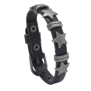 Punk rock black leather bracelet featuring vintage silver star studs and buckle