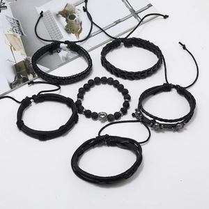 Detailed top view of 6-piece men's punk bracelet set with lion head and skull charms