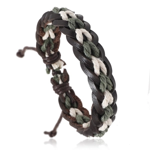 Detail of hand-woven leather and cotton cord bracelet with adjustable knot in retro style