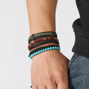 Bohemian multi-layer wrap bracelet featuring turquoise beads and braided leather straps