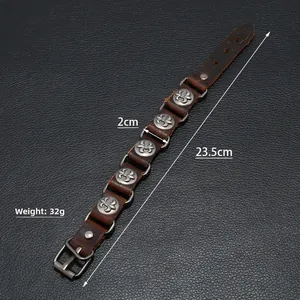 Detail view of brown leather punk bracelet showing 23.5cm length and fleur-de-lis studs