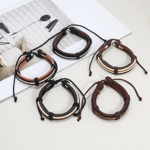 Retro multi-layer braided leather bracelet set in black and brown tones with cord closure