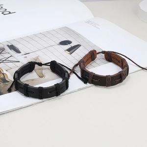Handmade braided wax rope and leather bracelets in black and dark brown with adjustable knot