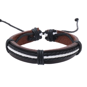 Macro detail of retro multi-layer braided leather bracelet with adjustable sliding knot
