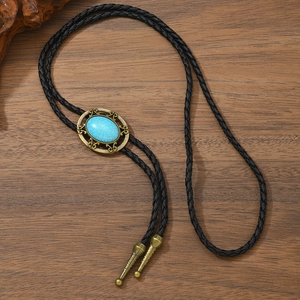 Cravate bolo western vintage avec turquoise bleue et détails en bronze sculpté
