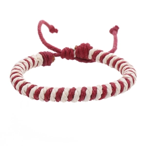 Detail of red and white spiral braided cord bracelet with adjustable sliding knot closure