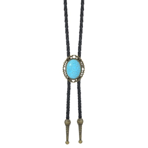 Détail de la cravate bolo vintage montrant la pierre turquoise et le cadre en métal sculpté