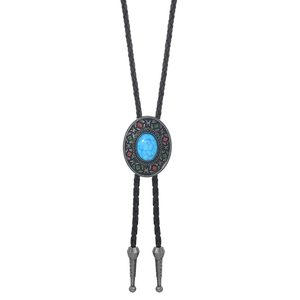 Detail of western bolo tie with blue turquoise inlay and black braided leather cord