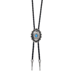 Macro detail of silver western bolo tie with turquoise stone and engraved metal aglets