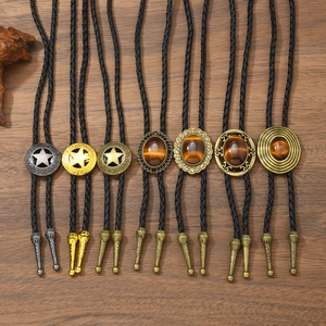 Vintage Western Bolo Tie Set mit Stern und Tigerauge Anhängern an geflochtener Lederkordel