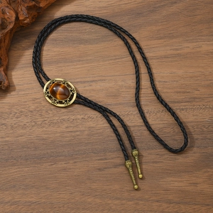 Retro-Bolo-Krawatte mit Tigerauge und Bronze-Stern an einer schwarzen Lederkordel