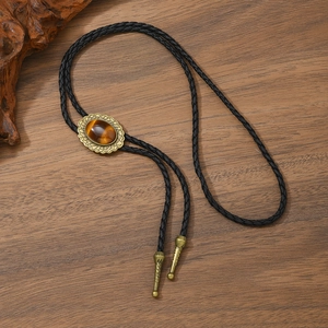 Vintage Bolo Tie mit Bronze-Sternanhänger und Tigerauge-Stein an einer schwarzen Lederkordel