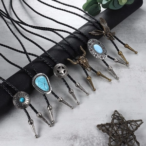 Collection of retro western bolo ties with turquoise and bull head motifs on woven leather cords