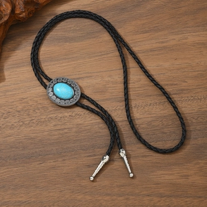 Detail of Celtic style bolo tie with turquoise stone and silver vintage pattern