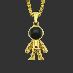 Detailed view of 3D gold astronaut pendant with black visor on thick box chain