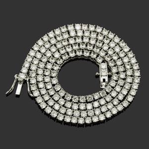 Macro view of silver-tone tennis chain necklace with clear round-cut cubic zirconia stones