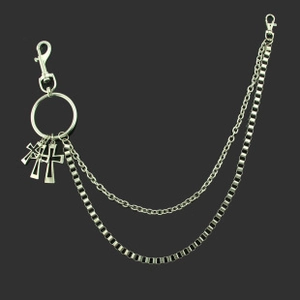 Detail of punk style double-layered silver waist chain with three cross pendants