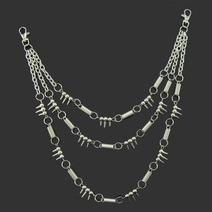 Close-up of triple-layered silver punk belt chain with metallic spikes and lobster clasps