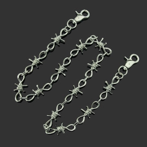 Detailed view of silver barbed wire link pant chain with secure metal lobster clasps