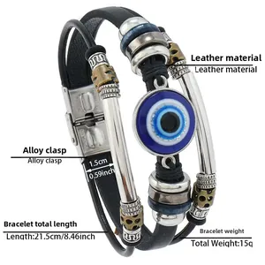 Detail showing mens leather bracelet with blue evil eye bead and gold skull accents