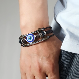 Handmade multilayer leather bracelet with evil eye bead and vintage metal accents