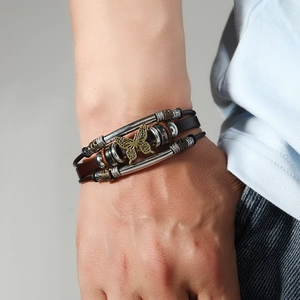 Retro multi-layer leather bracelet featuring a bronze butterfly charm and metal accents
