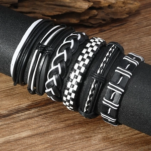 Hip hop braided leather bracelet set with checkered patterns on a wooden background