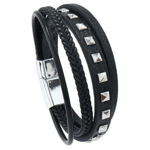 Detail of multi-layer leather bracelet with silver metal studs and magnetic buckle