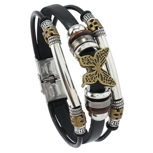Multi-layer leather bracelet featuring bronze butterfly charm and stainless steel clasp