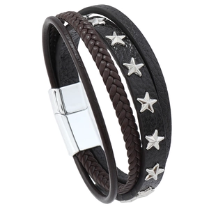 Detail of men's multilayer leather bracelet featuring star rivets and magnetic clasp