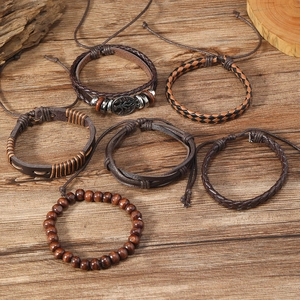 6pcs vintage tree of life braided leather bracelets set for men on a dark wood background