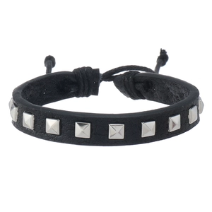 Close-up of adjustable punk leather bracelet featuring square silver metal rivets and cord