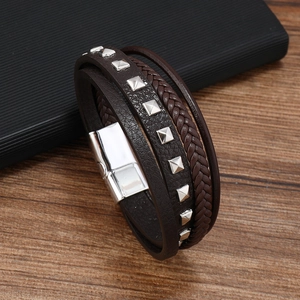 Close-up of brown leather multi-layer bracelet with metal studs and magnetic clasp