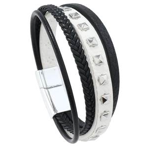 Detail of multi-layer leather bracelet featuring silver studs and magnetic buckle clasp
