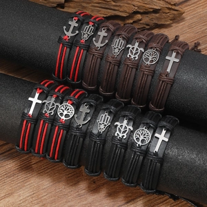 Handmade woven leather bracelet set with cross, anchor, and tree of life charms