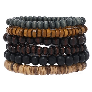 Detail of multi-layer wood bead bracelets featuring diverse natural textures and earthy tones
