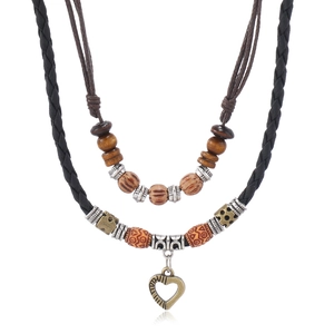 Vintage bohemian layered wooden bead necklace with an antique heart pendant on cord
